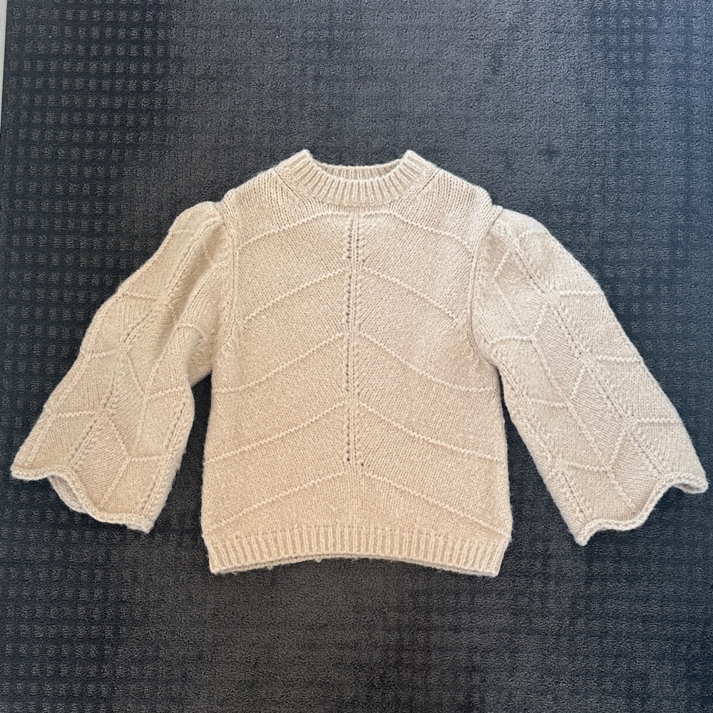 Chic Cream Sweater with Patterned Sleeves